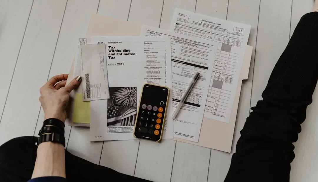 Calendar and IRS Form 4868 on a desk showing the October tax extension deadline in Utah